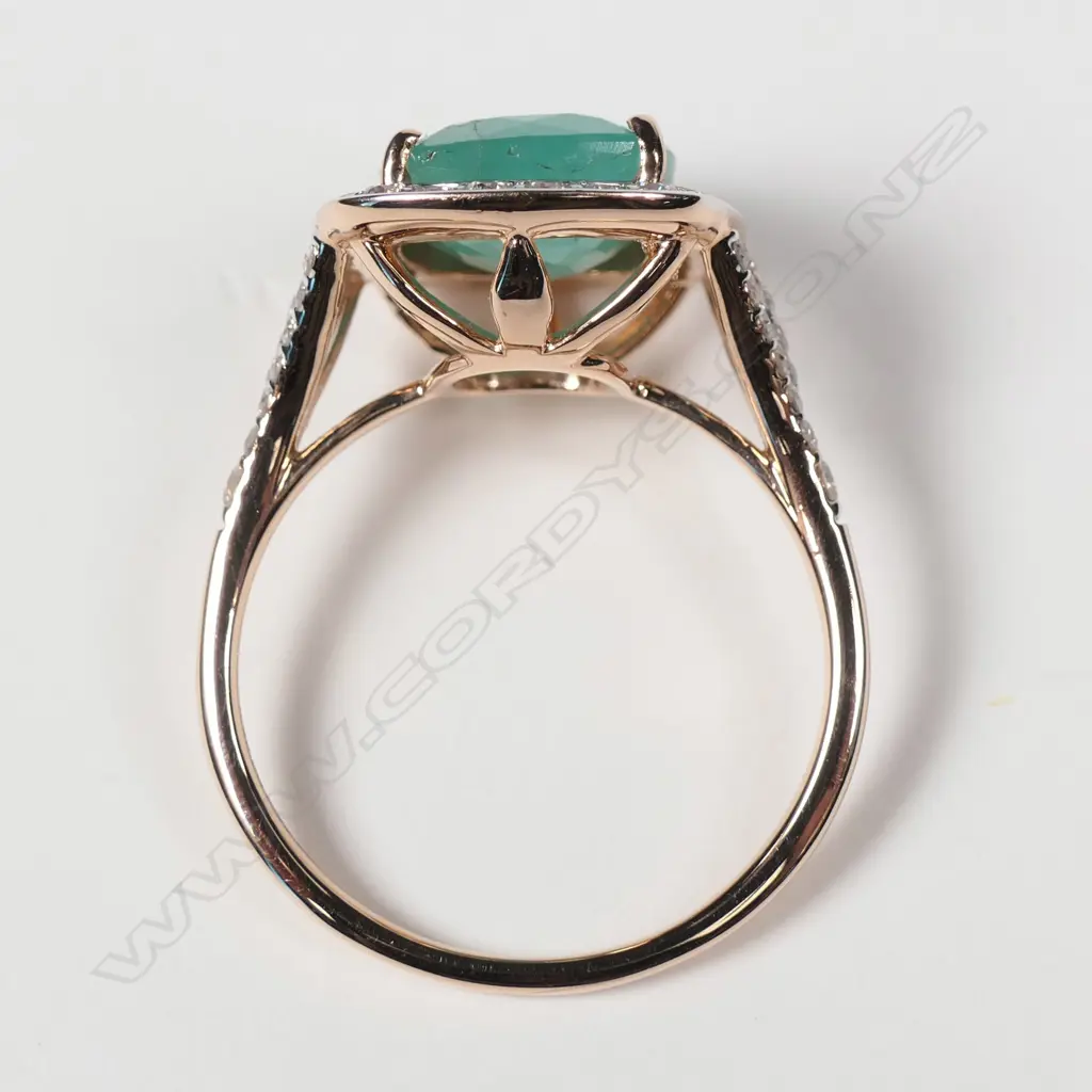 14ct rose gold Columbian emerald and diamond halo ring Image 1++