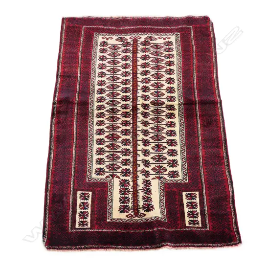 A hand knotted Balouchi tribal prayer rug