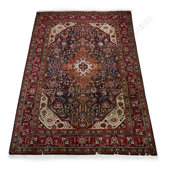 A hand knotted Iranian Tabriz carpet