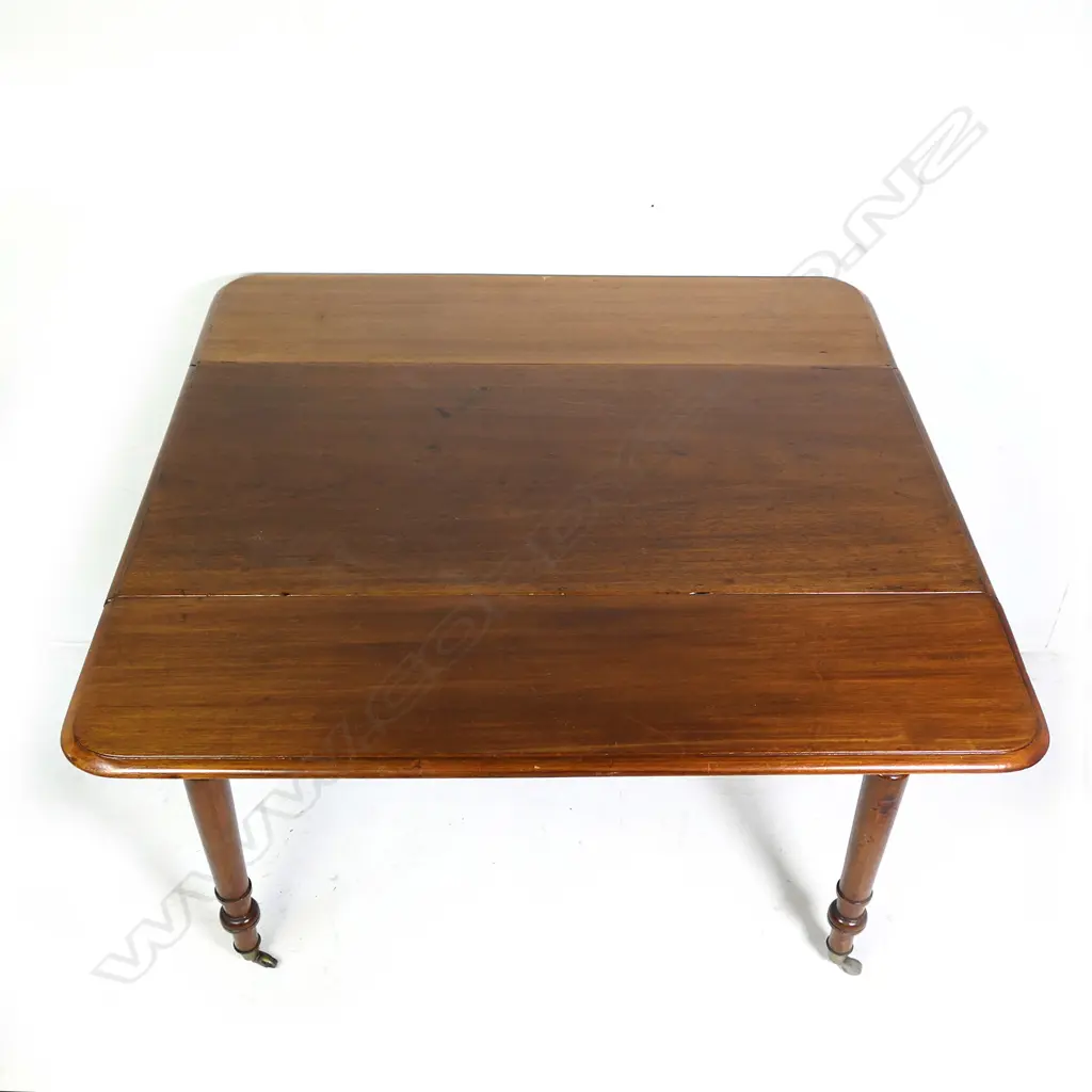 A Victorian mahogany drop leaf table Image 1++