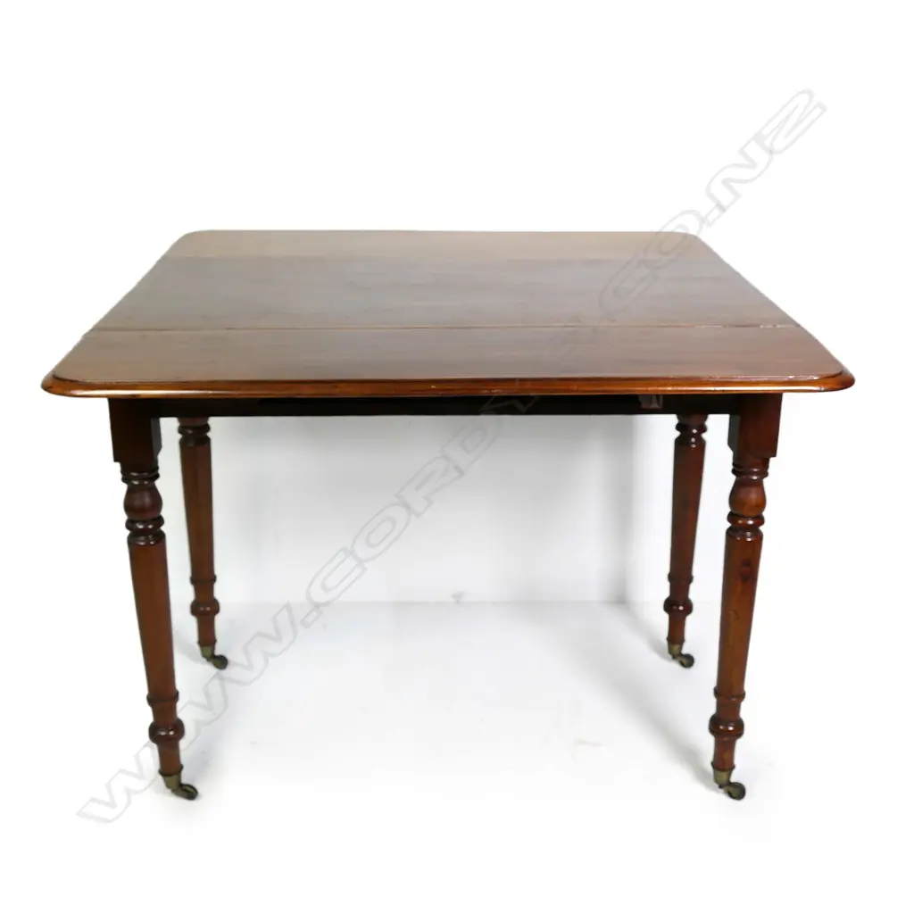 A Victorian mahogany drop leaf table Image 1++