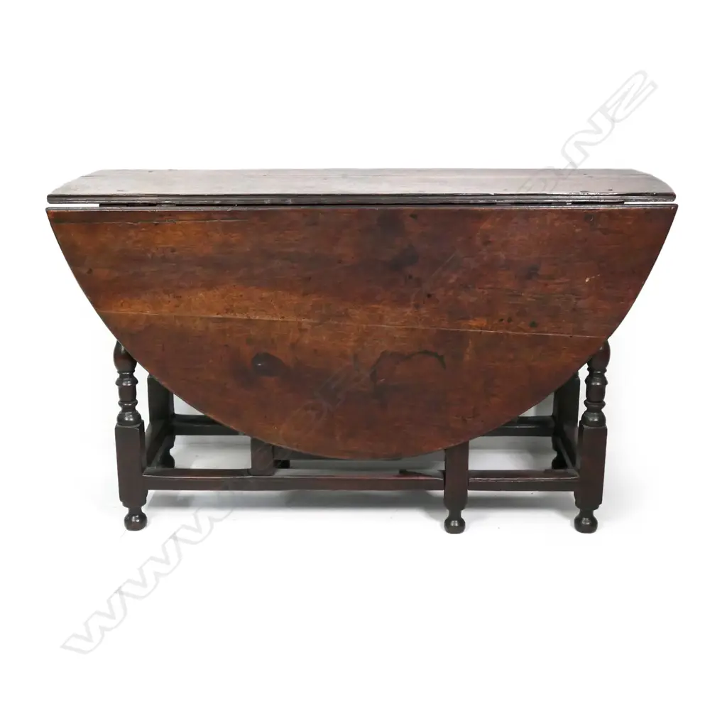 A George II/III country oak drop-side gate leg table Image 1++