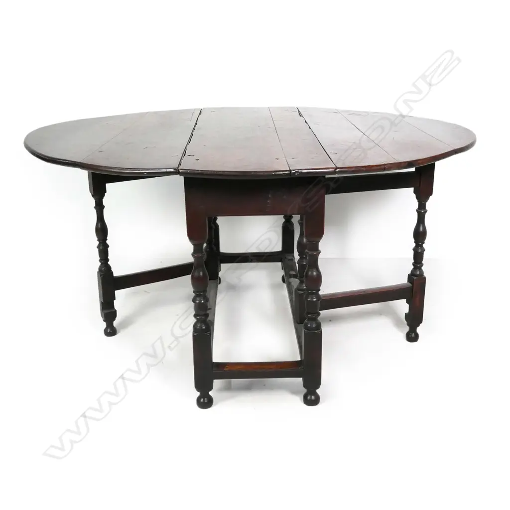 A George II/III country oak drop-side gate leg table Image 1++