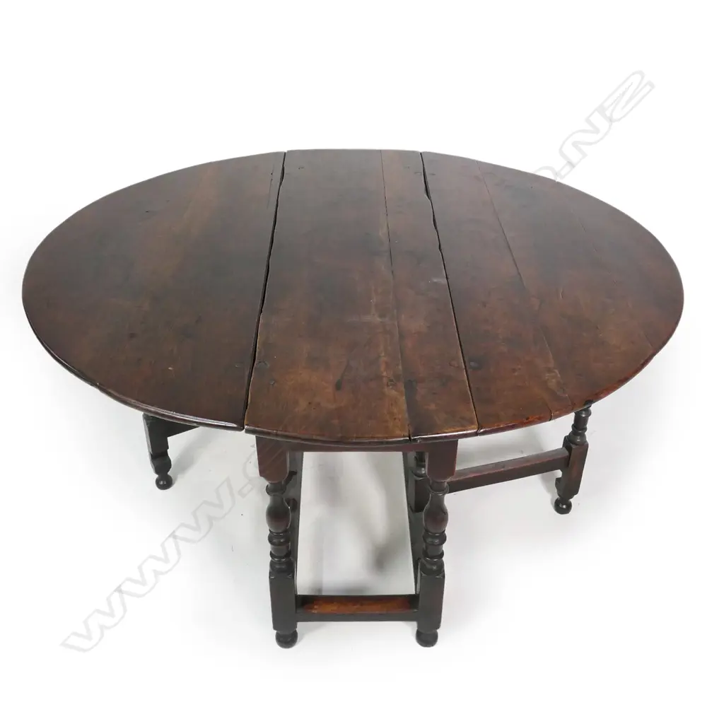 A George II/III country oak drop-side gate leg table Image 1++