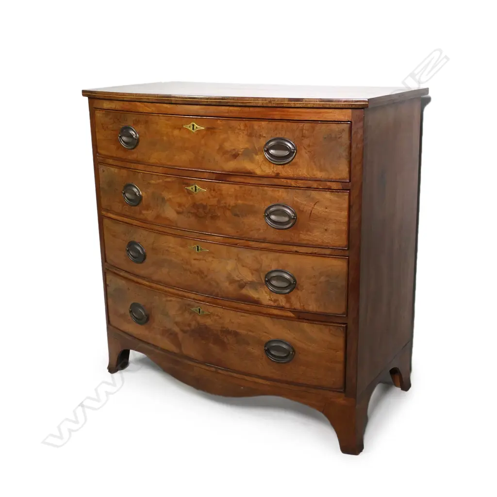 A Georgian mahogany four drawer bowfront chest Image 1++