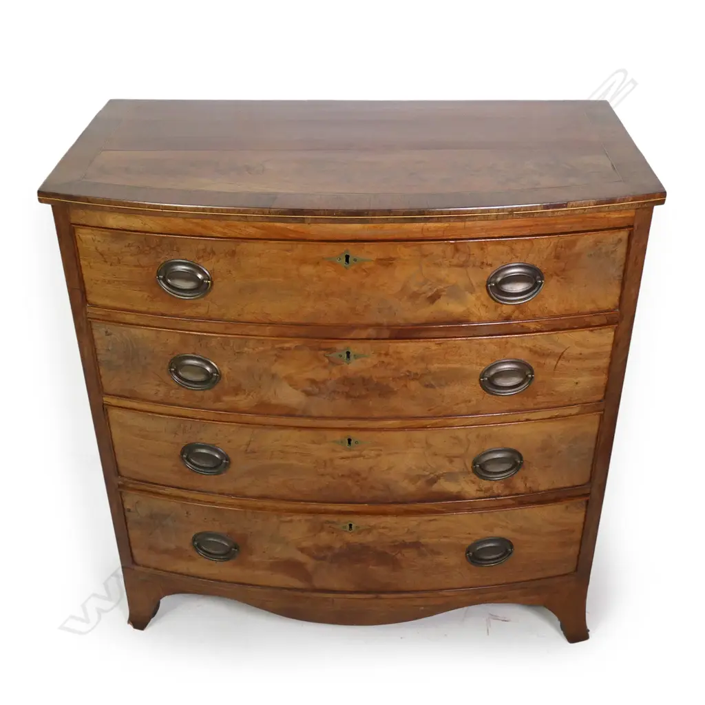 A Georgian mahogany four drawer bowfront chest Image 1++