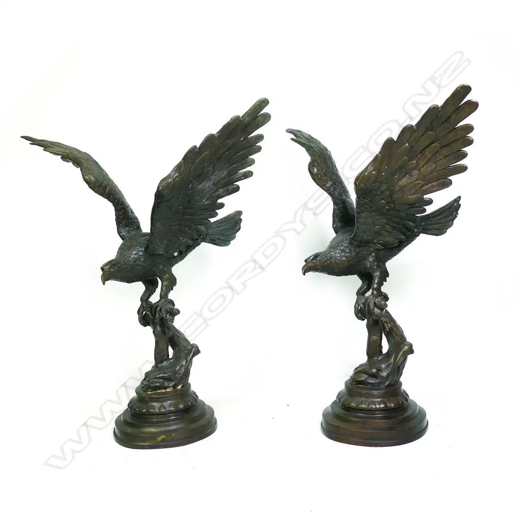A pair of cast bronze statuettes of eagles Image 1++