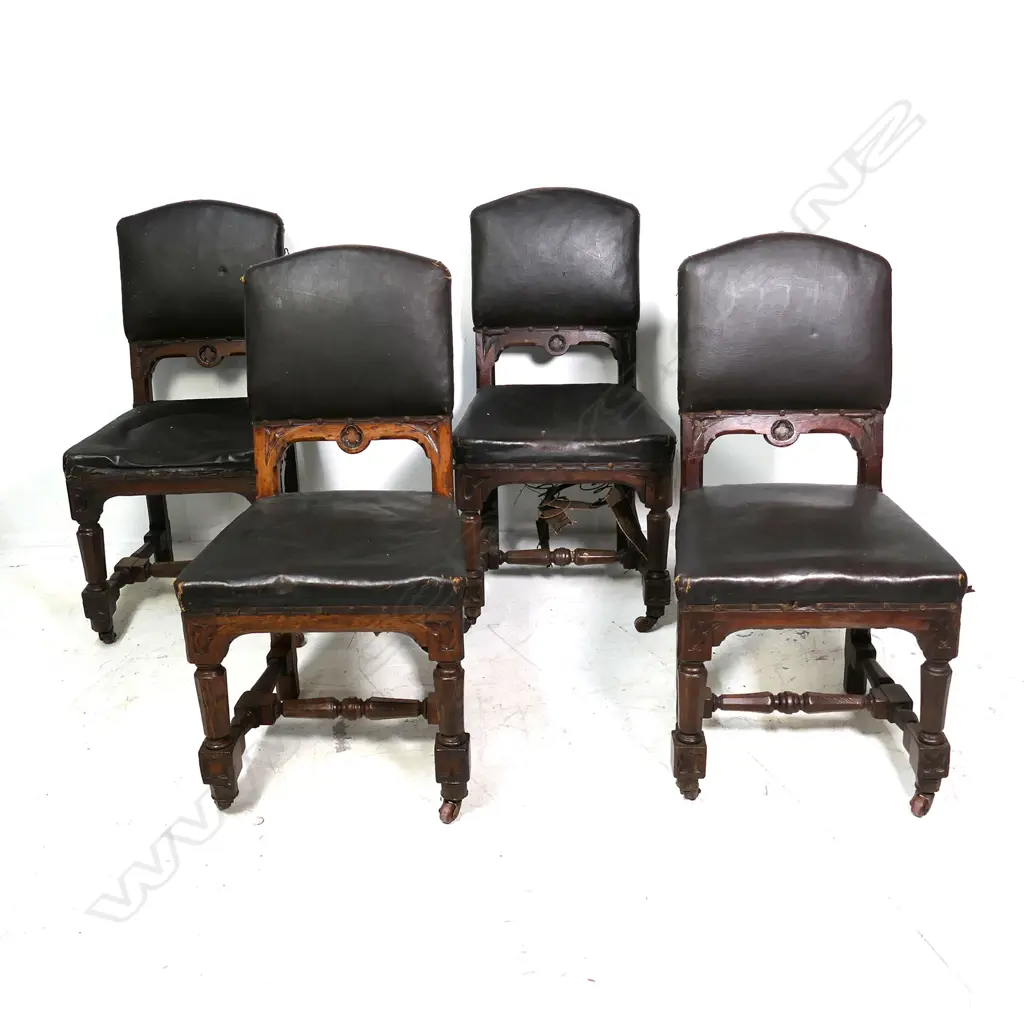 A set of four Victorian Gothic oak dining chairs Image 1++