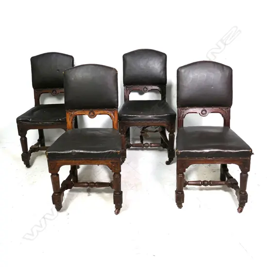 A set of four Victorian Gothic oak dining chairs