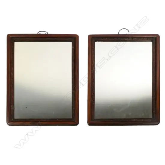 A pair of Chinese hardwood framed wall mirrors