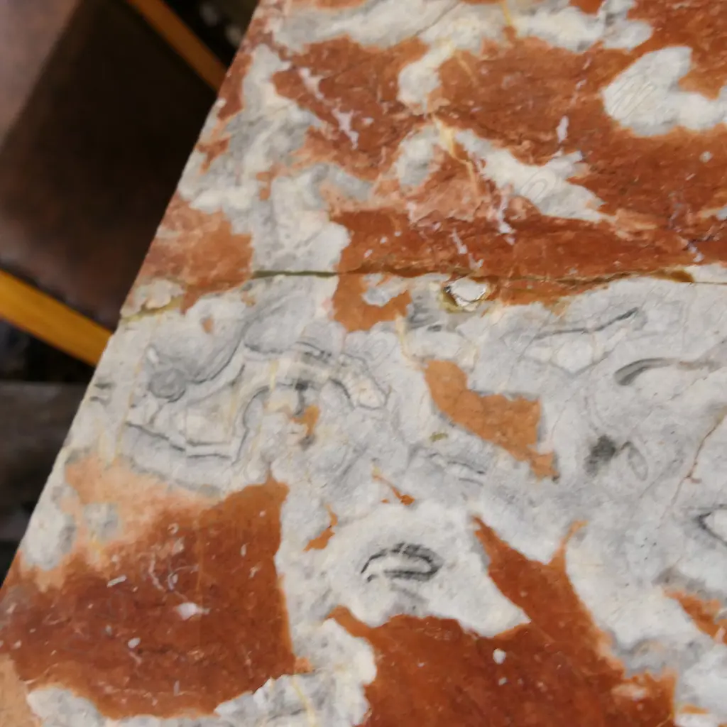 A pair of stylish French plinths, cream painted gesso and parcel gilt with rouge griotte marble tops, each of tapering shape with concealed cabinets surmounted by swollen capitals and raised from cavetto plinths. Marble repaired to one. 610 x 410 x 1350mm. Image 1++