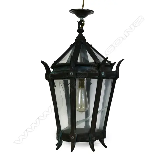 A bronze and glass portico light