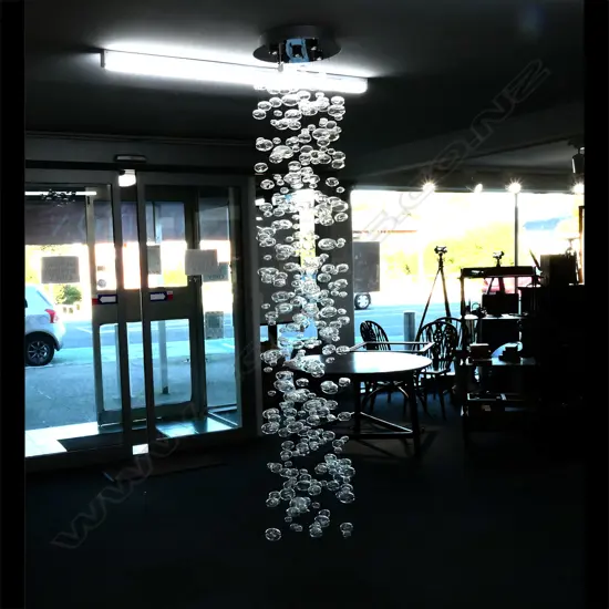 A contemporary long multi strand ceiling light fitting