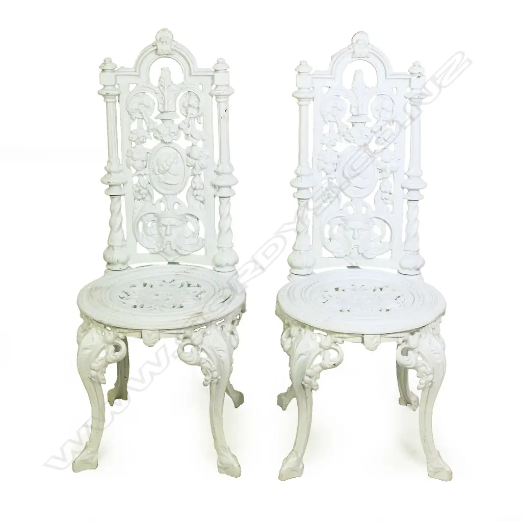A pair of cast iron high back chairs Image 1++
