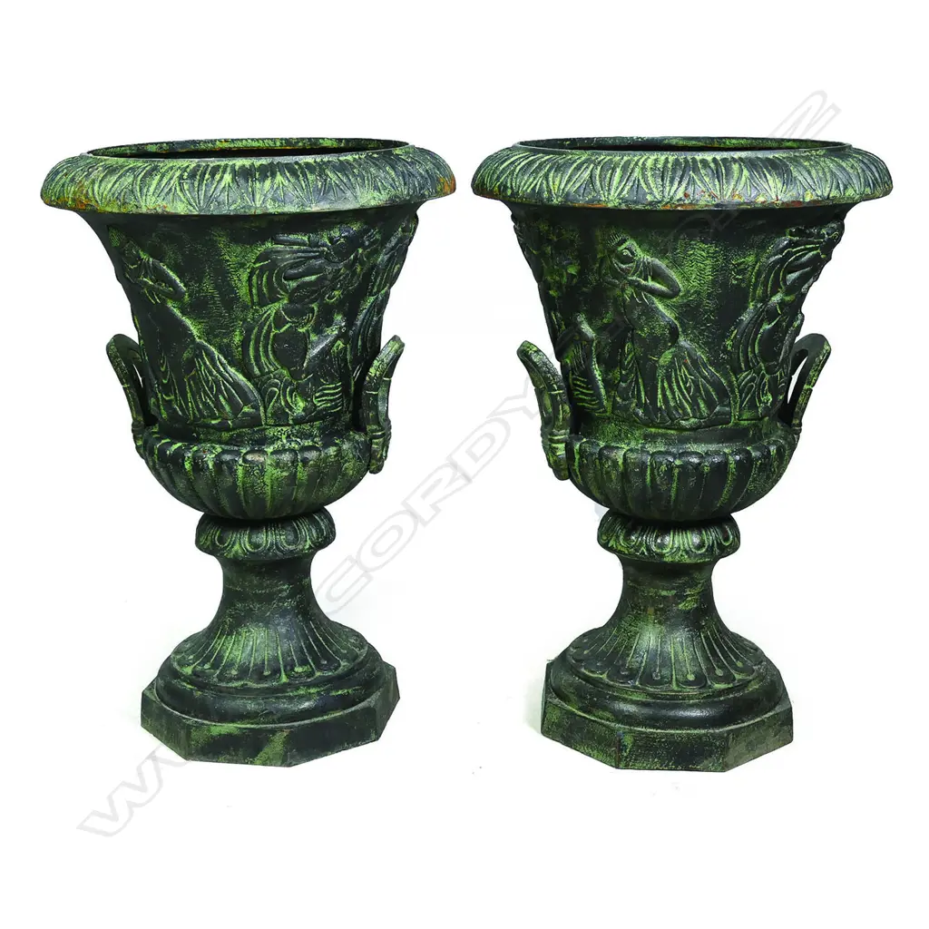 A pair of cast iron garden urns Image 1++