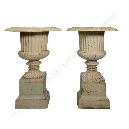 A pair of large and impressive cast iron garden urns