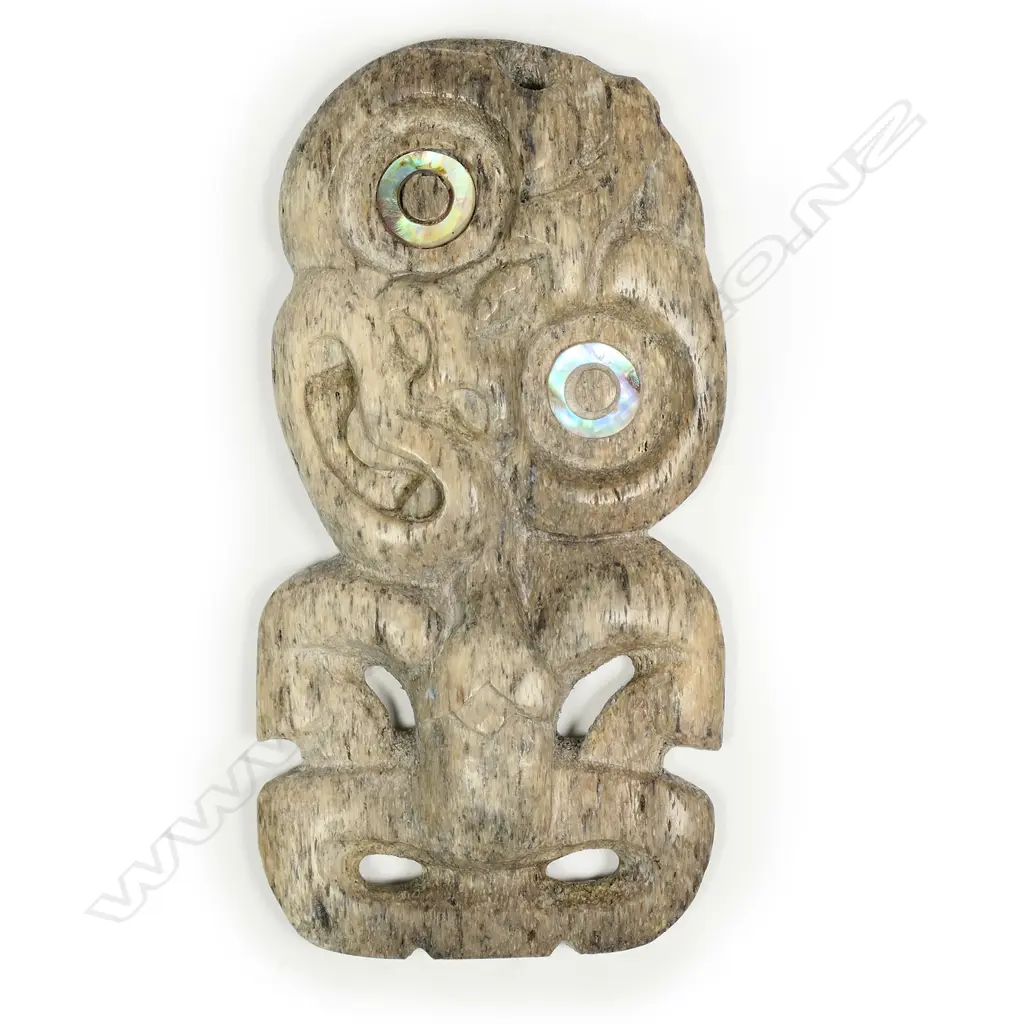 A Maori carved whale bone hei tiki Image 1++