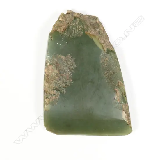 An old Maori carved pounamu toki (adze)