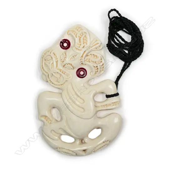 A late 20thC Maori carved whalebone hei tiki