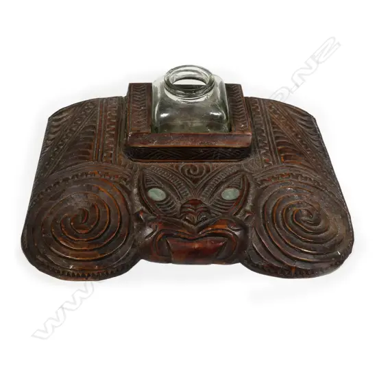 An early 20thC Maori carved inkwell desk stand