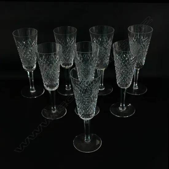 A set of eight Waterford crystal champagne flutes