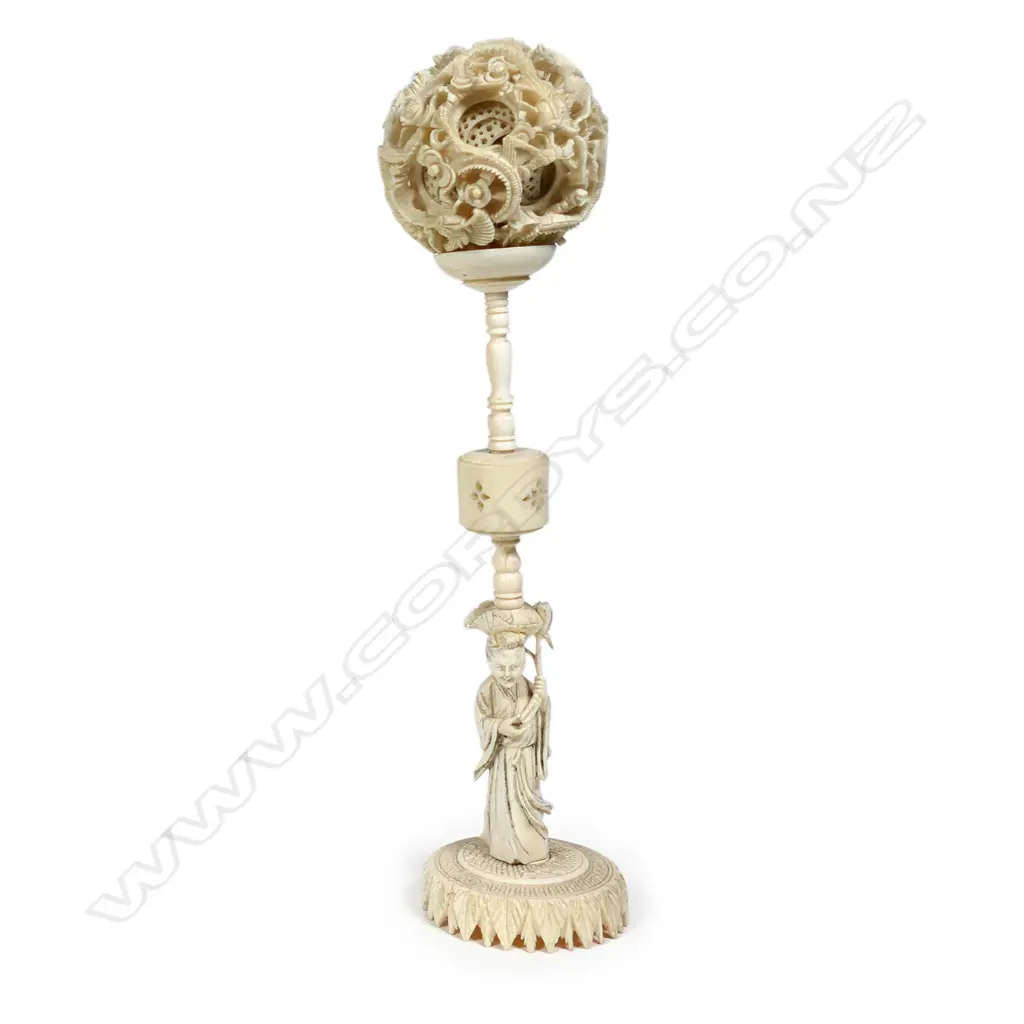 A Chinese carved ivory puzzle ball on stand Image 1++