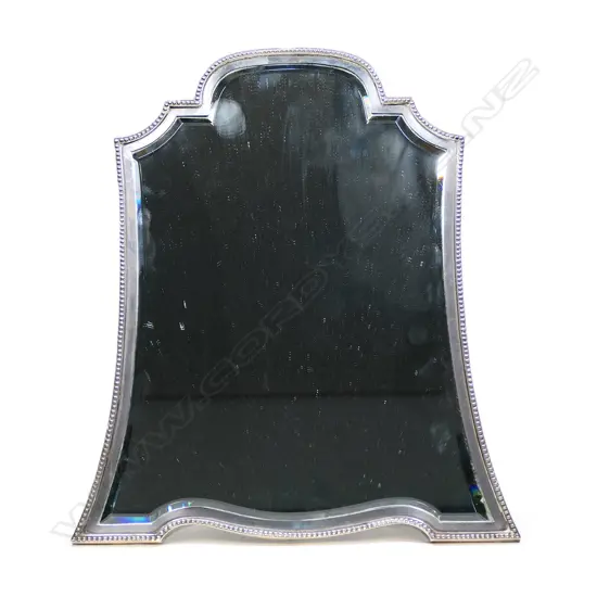 A silver framed mirror