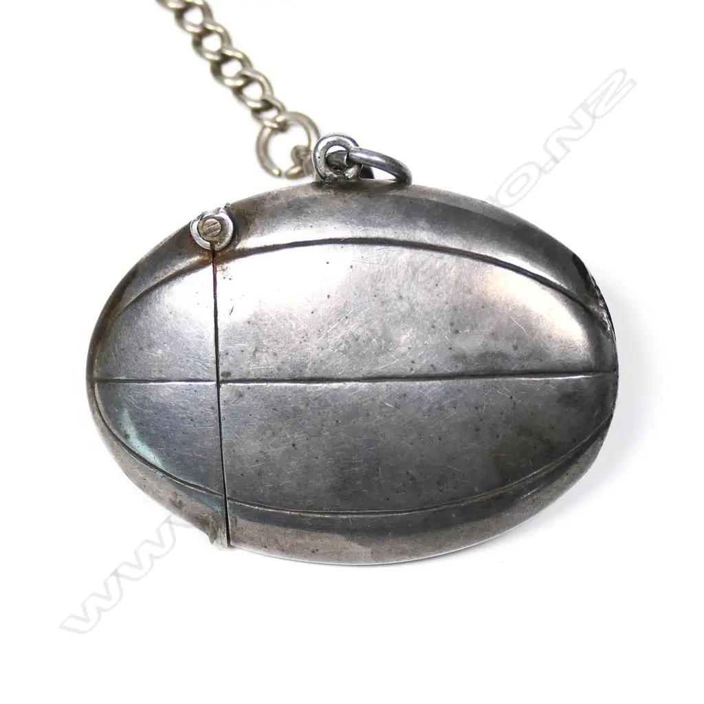 A rare Edwardian silver rugby ball form vesta with fob chain Image 1++
