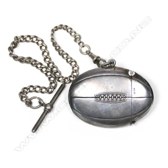 A rare Edwardian silver rugby ball form vesta with fob chain