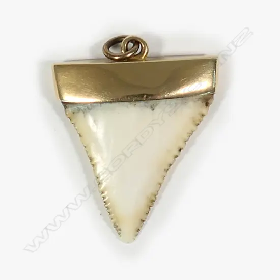 A 9ct rose gold and shark's tooth pendant