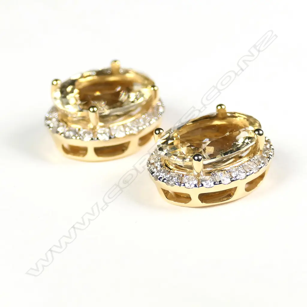 A pair of 14ct gold heliodor and diamond halo stud earrings Image 1++