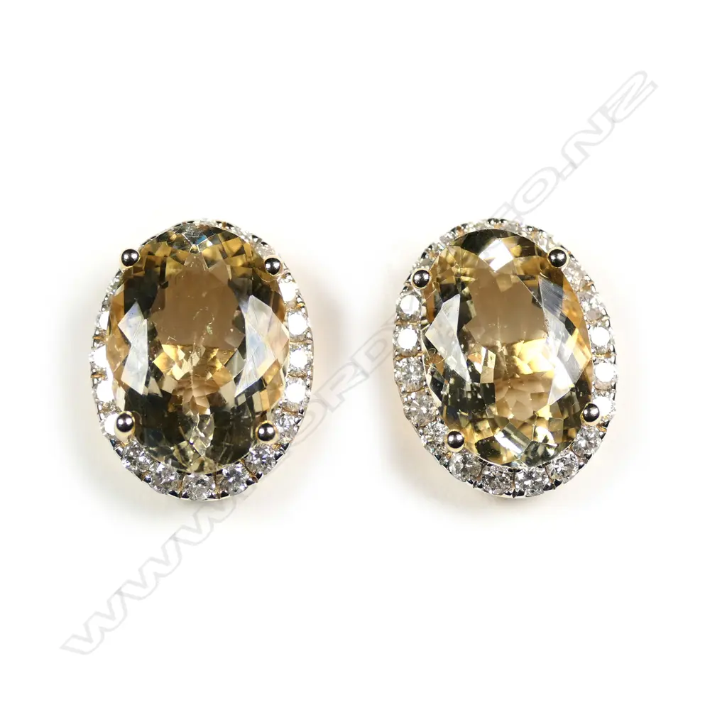 A pair of 14ct gold heliodor and diamond halo stud earrings Image 1++