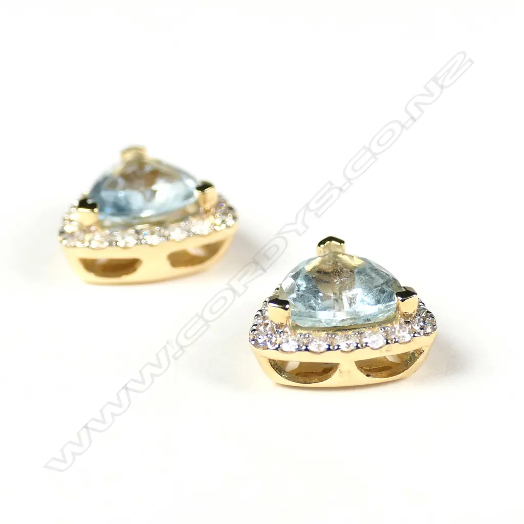 A pair of 14ct gold aquamarine and diamond stud earrings Image 1++