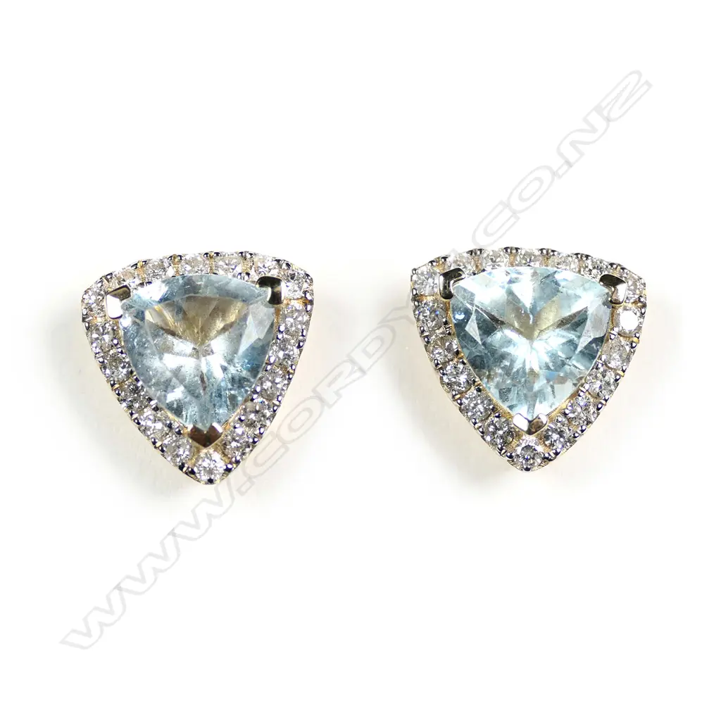 A pair of 14ct gold aquamarine and diamond stud earrings Image 1++