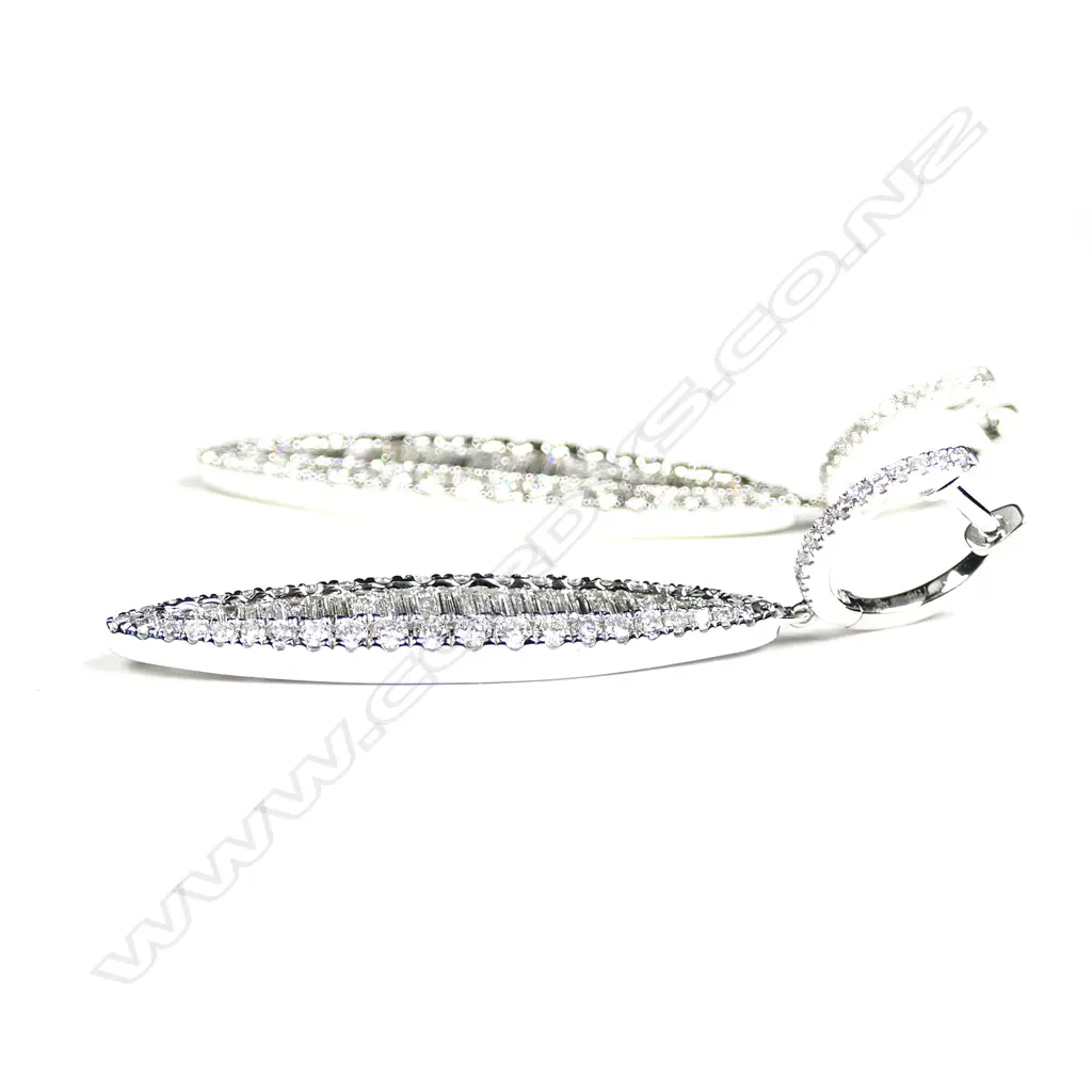 A pair of 18ct white gold and diamond earrings Image 1++