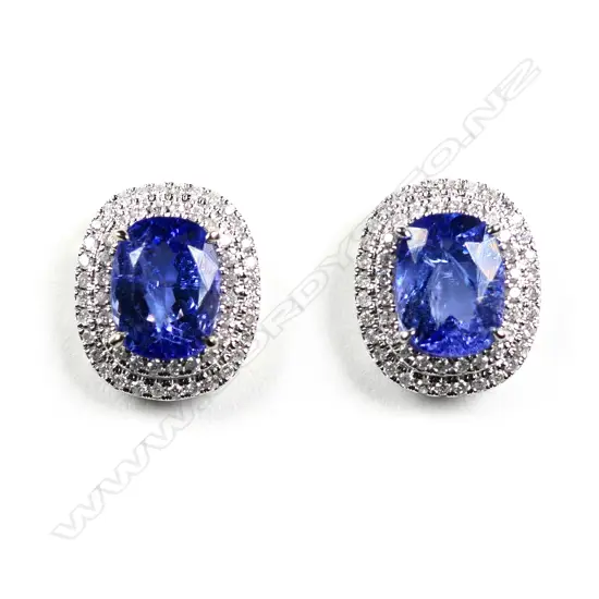 A pair of 14ct white gold tanzanite and diamond double halo stud earrings