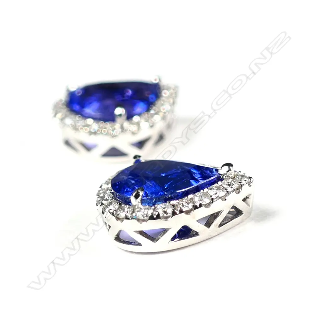 A pair of 14ct white gold tanzanite and diamond halo stud earrings Image 1++