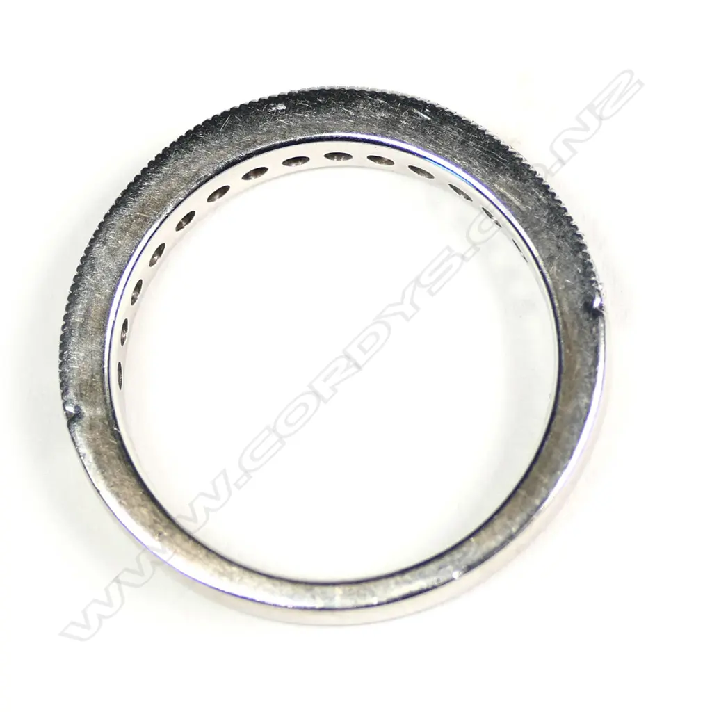 An 18ct white gold and diamond set band Image 1++