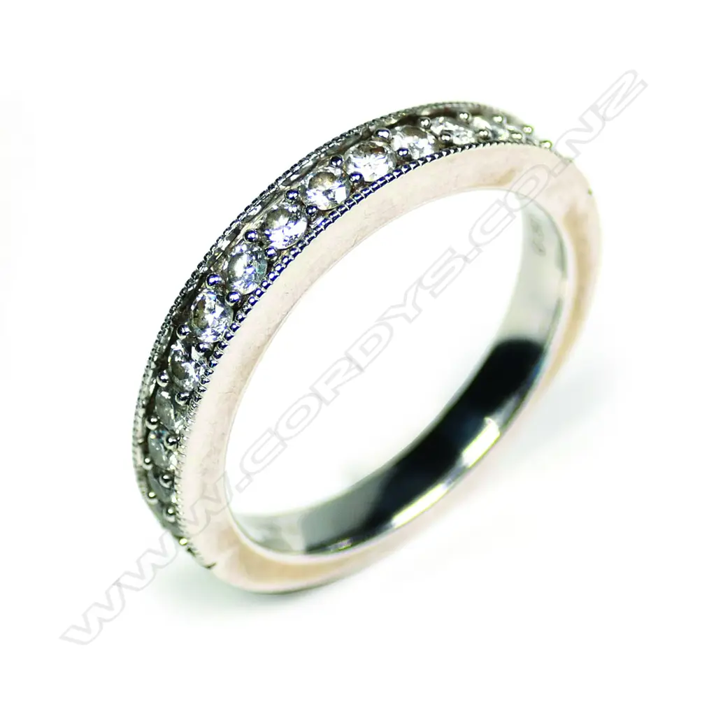An 18ct white gold and diamond set band Image 1++