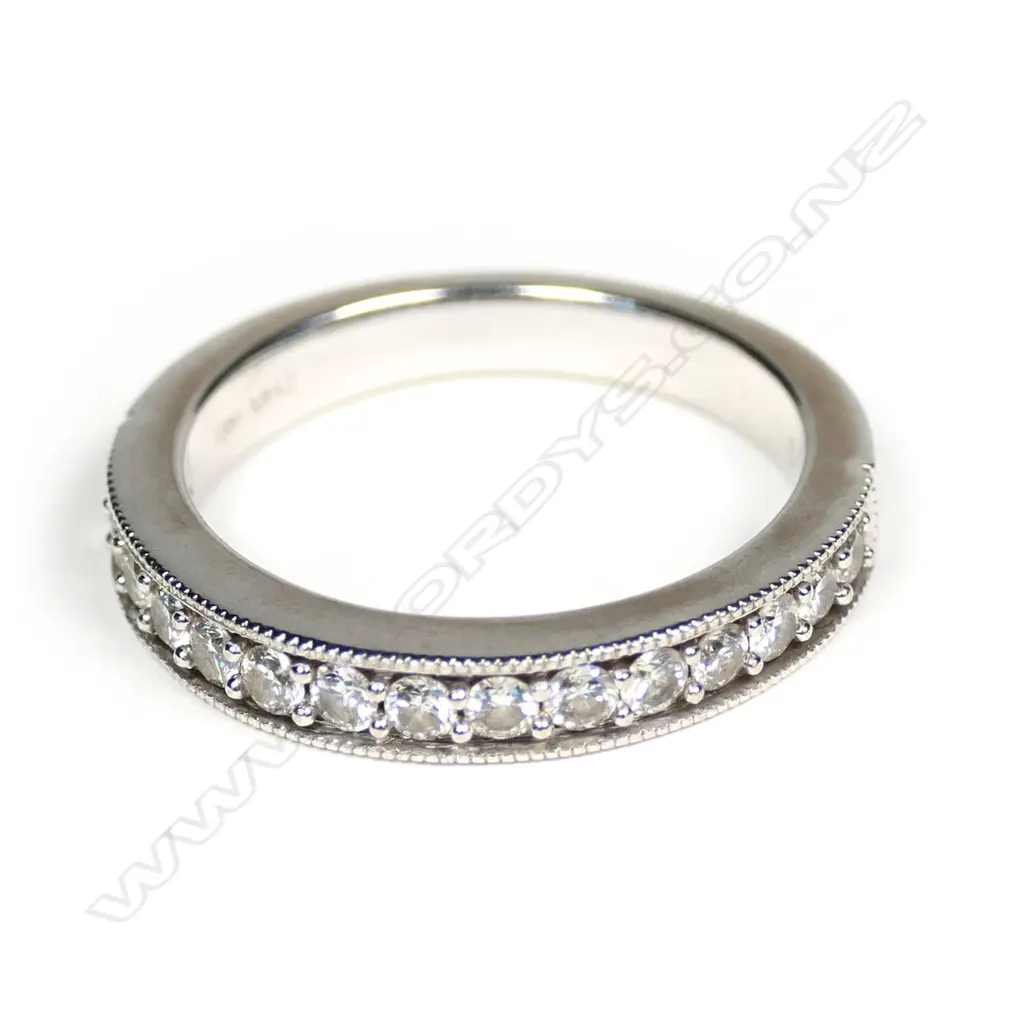 An 18ct white gold and diamond set band Image 1++