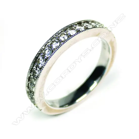 An 18ct white gold and diamond set band