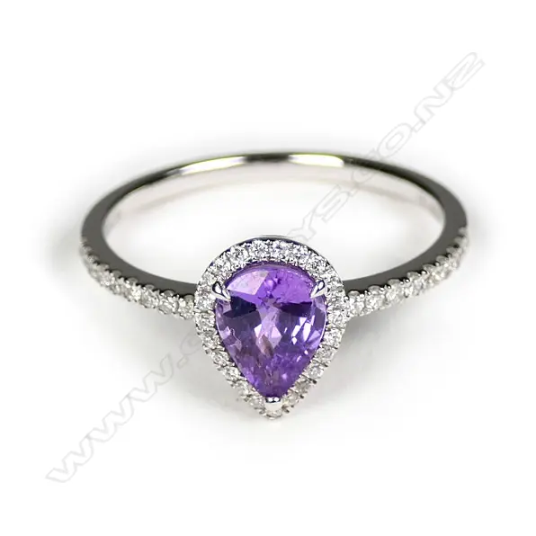 A 14ct white gold sapphire and diamond halo ring Image 1++