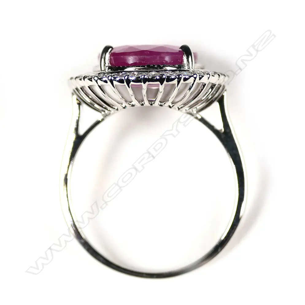 A 14ct white gold sapphire and diamond halo ring Image 1++