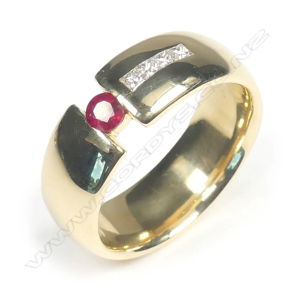 A 18ct gold ruby and diamond ring Image 1++