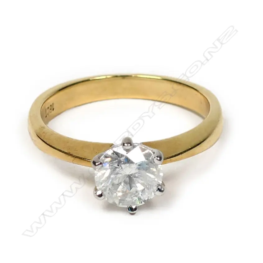 An 18ct gold and diamond solitaire ring Image 1++