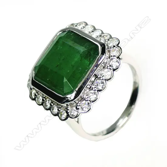 A 14ct white gold emerald and diamond cocktail ring