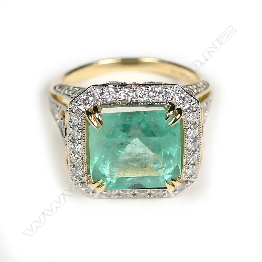 A 14ct yellow and white gold Columbian emerald and diamond cocktail ring Image 1++