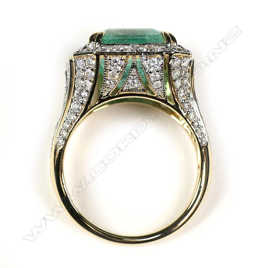 A 14ct yellow and white gold Columbian emerald and diamond cocktail ring Image 1++
