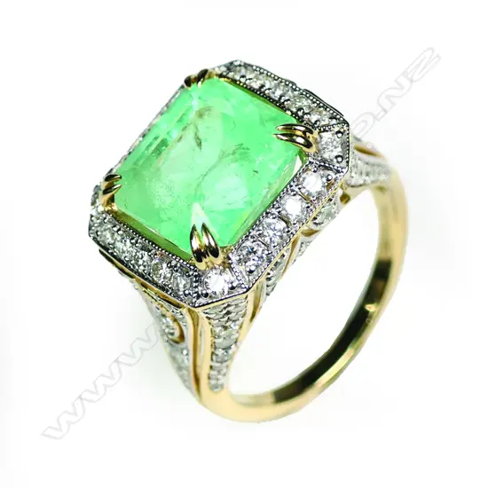 A 14ct yellow and white gold Columbian emerald and diamond cocktail ring