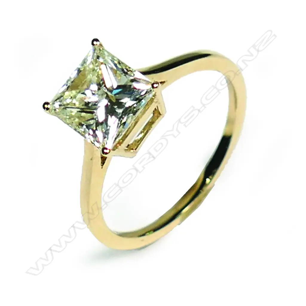 A 14ct gold light fancy yellow diamond solitaire ring Image 1++